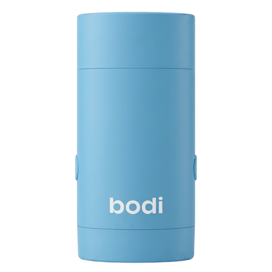 bodi refillable deodorant case in blue, closed, front view on a dark green background